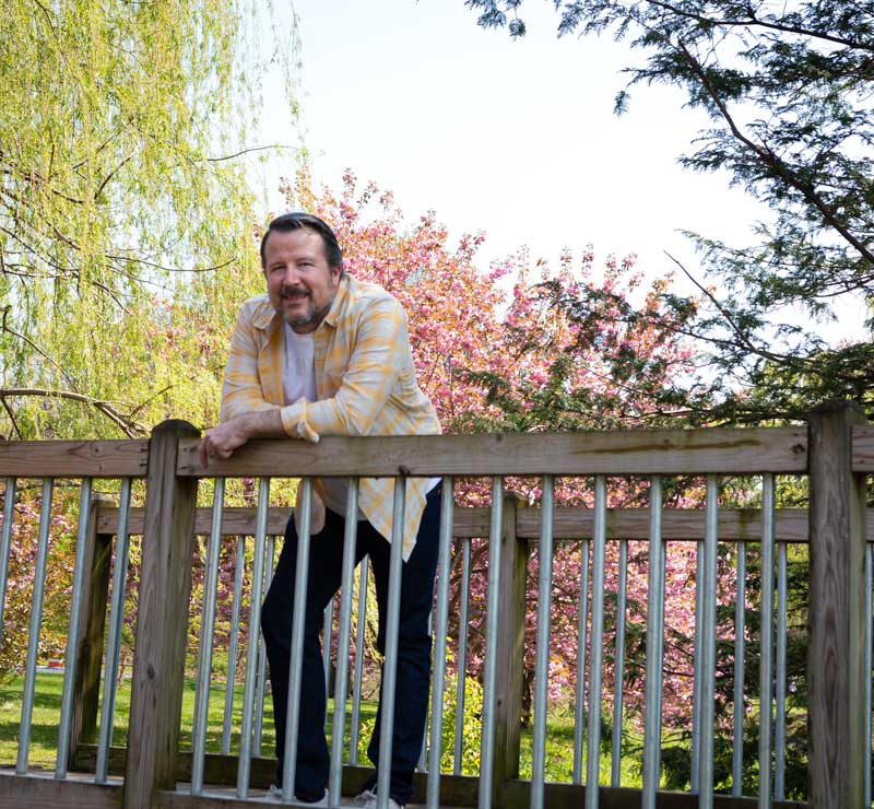 CIEL's Scott Thomas Fischer wearing Levi's Wellthread jeans, linen shirt, and cotton T-shirt from Outerknown Apparel