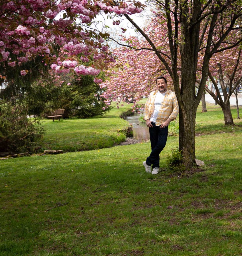 CIEL's Scott Thomas Fischer wearing Levi's Wellthread jeans, linen shirt, and cotton T-shirt from Outerknown Apparel